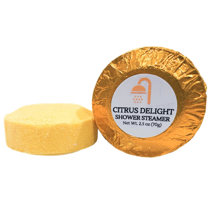 Extra-large 2.5 oz Citrus Delight shower steamer, individually wrapped in vibrant colored foil, releasing a refreshing blend of lemon, lime, and orange for an energizing shower experience.