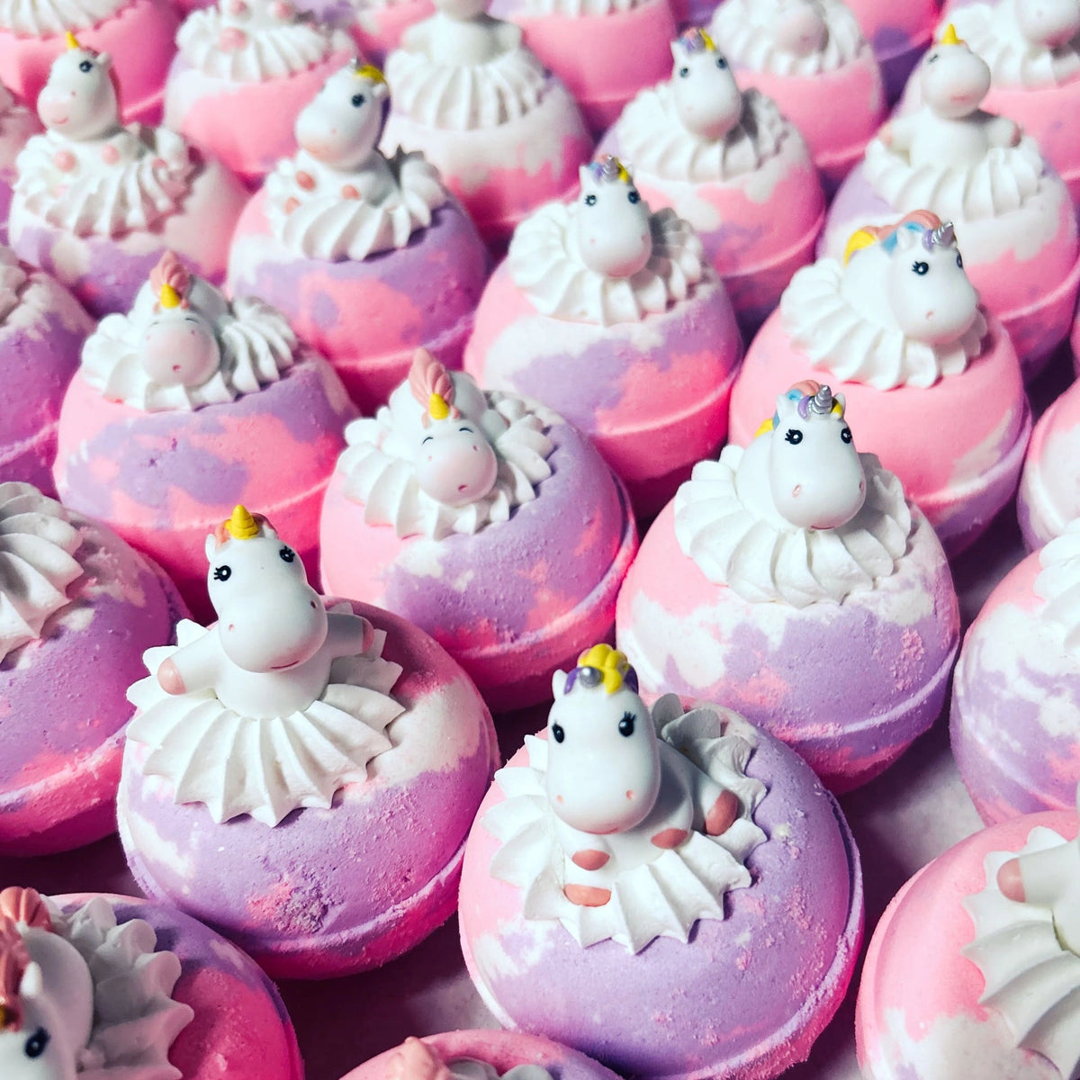 Unicorn Bath Bombs with surprise toys in bubble bath frosting