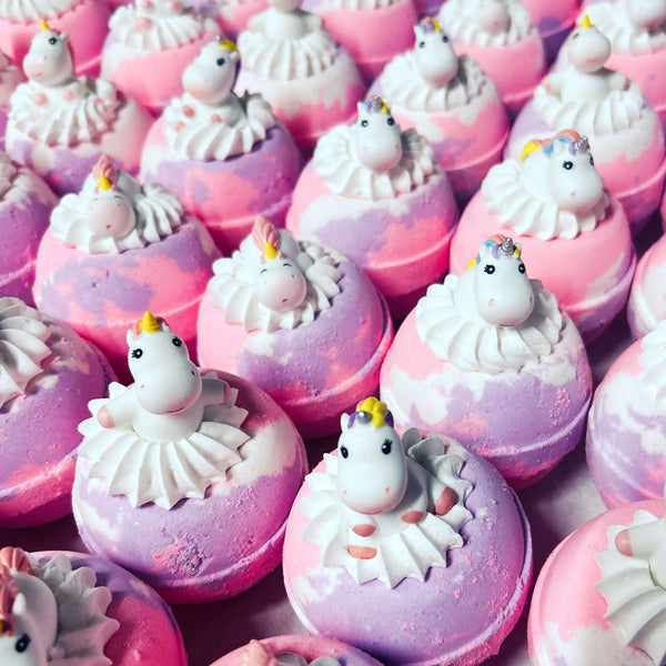 Unicorn Bath Bombs with surprise toys in bubble bath frosting